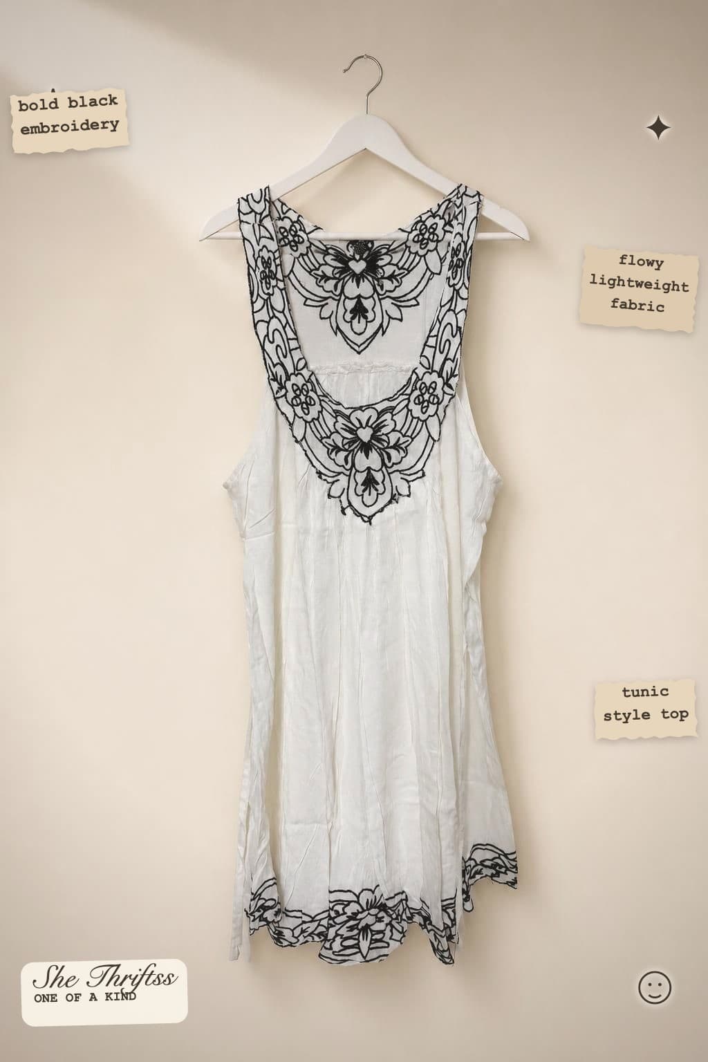 White embroidered sleeveless top